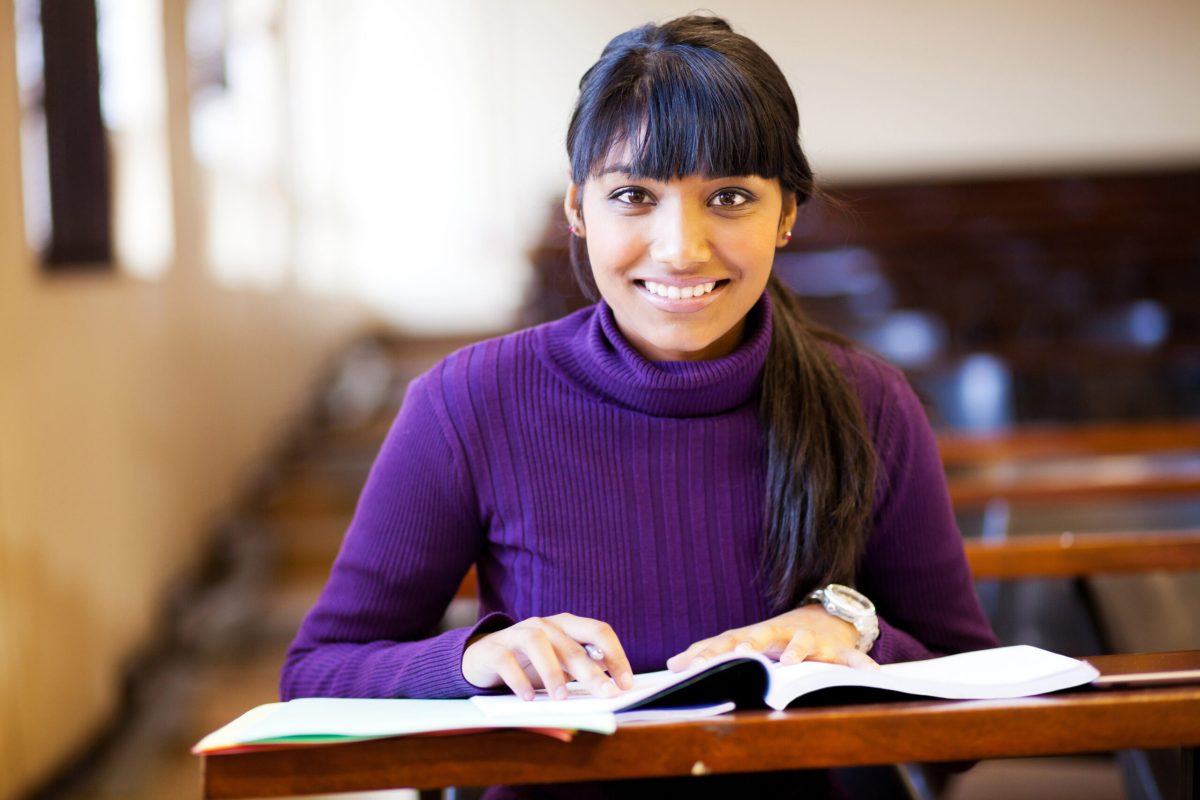 beautiful young female college student in lecture hall